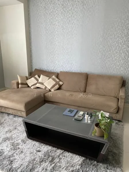 Living features: L-shape sectional sofa in beige, decorative throw pillows in cream and brown, coffee table with grey top and dark wood base, area rug in light grey, wall with textured wallpaper in light tones, plant in ceramic pot on coffee table; style: modern.