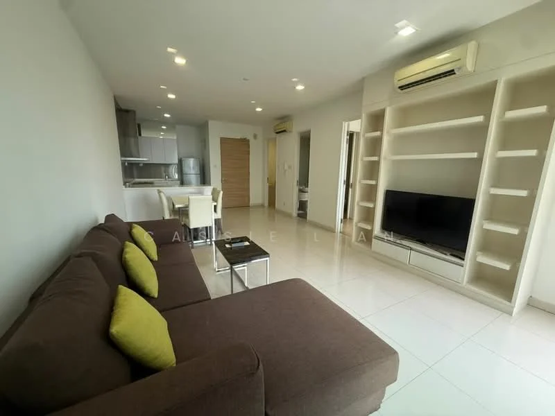 Living features: 3-seater fabric sofa in brown, yellow accent cushions, coffee table with glass top, wall-mounted TV, built-in shelving unit, recessed downlights, white painted walls, glossy tile flooring, air conditioning unit; style: modern. Kitchen features: open kitchen layout, stainless-steel fridge, built-in oven, ceramic cooktop, white cabinetry, grey countertop, sink with faucet; style: modern.