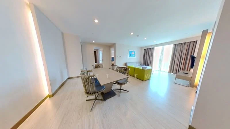 Living features: light wood flooring, neutral painted walls, floor-to-ceiling windows, sheer curtains, dining table with chairs, sofa in green, TV console, recessed lighting, decorative wall lighting, open layout, area rug; style: modern.