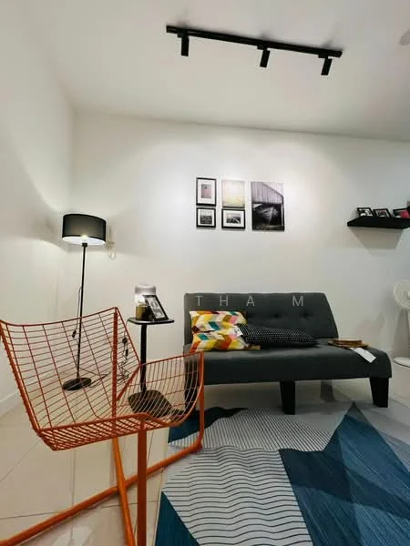 Living features: grey fabric sofa, orange wire chair, black floor lamp, framed artwork on walls, decorative cushions, blue area rug with geometric pattern, shelf with decorative items, recessed lighting, white painted walls, glossy tile flooring; style: modern.