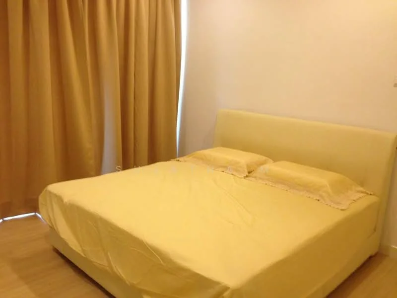 Bedroom features: queen-size bed with upholstered headboard, yellow bed linens, two yellow pillows, light wood flooring, cream painted walls, floor-to-ceiling curtains in light brown, natural light from window, minimalist decor; style: modern.