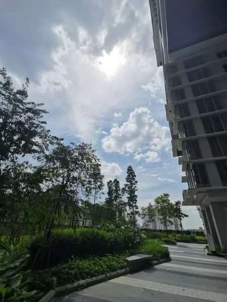 Exterior features: landscaped garden, manicured lawn, mature trees, stone-paved walkway, modern building facade, cloudy sky, sunlight breaking through clouds; style: modern.