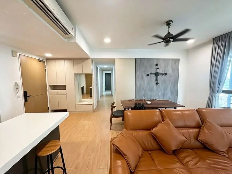 Living features: brown leather sectional sofa, 4-seater dining table, ceiling fan, wall-mounted TV, wooden flooring, decorative wall with grey panel, large windows with curtains, open layout to kitchen, air conditioning unit; style: modern. Kitchen features: white cabinetry, kitchen island with bar stools, stainless-steel sink, built-in oven, ceramic tile backsplash, recessed lighting; style: modern. Room features: light-colored walls, wooden door, hallway leading to other rooms.