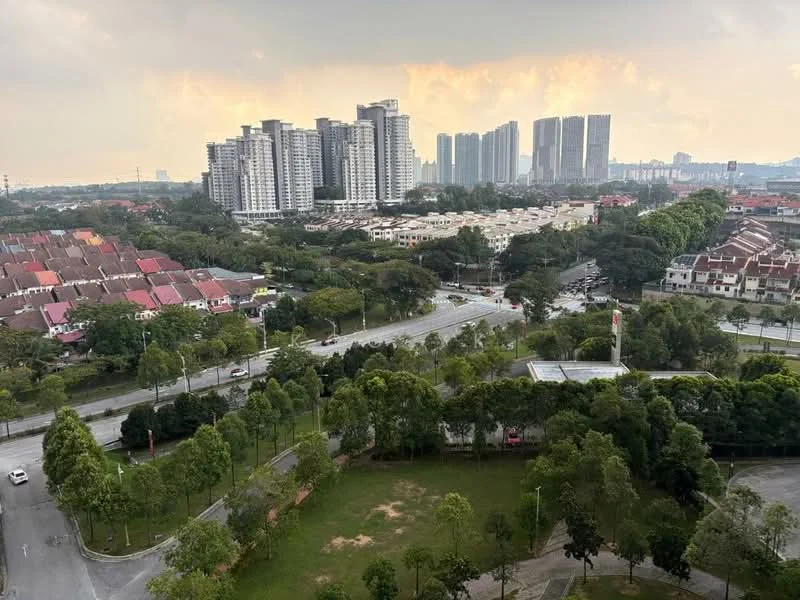 Exterior type: high-rise condominium; features: city skyline view, surrounded by greenery, manicured lawns, multiple high-rise buildings, residential housing in foreground, open road, park area; style: modern.