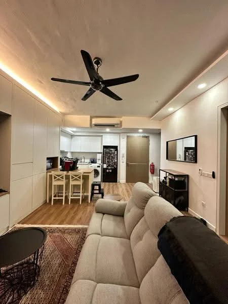 Living features: 3-seater fabric sofa in light beige, black coffee table, area rug with geometric pattern, 5-blade ceiling fan with light, recessed LED downlights, wall-mounted mirror, wooden flooring, open-plan layout to kitchen, fire extinguisher on wall; style: modern. Kitchen features: white cabinetry, stainless-steel fridge, built-in oven, freestanding washing machine, white countertop, bar counter with stools, ceramic tile backsplash, induction hob; style: modern.