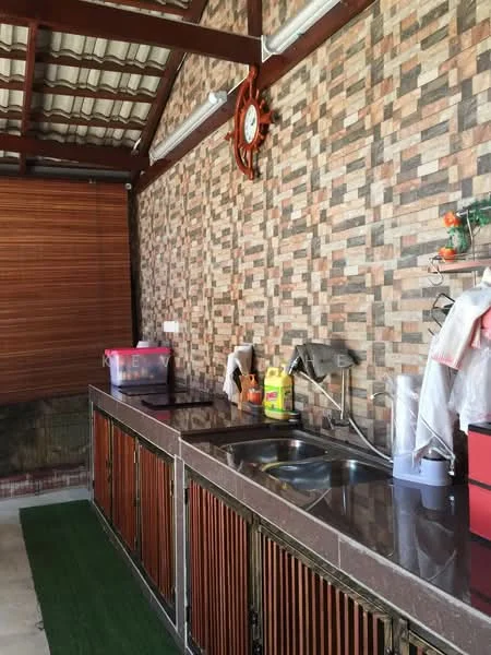 Kitchen features: brown tiled walls with stone pattern, dark granite countertop, wooden cabinetry with slatted doors, double-bowl stainless-steel sink, chrome faucet, wall-mounted clock, plastic storage containers, cleaning supplies, green carpet runner; style: modern.