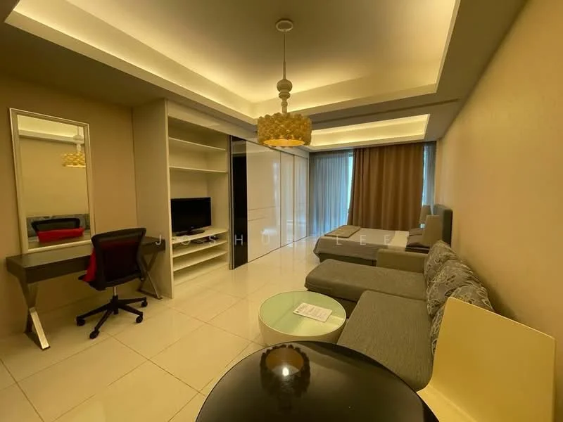 Living features: grey fabric sectional sofa, round glass coffee table, black office chair, wooden desk, wall-mounted TV, built-in shelving unit, floor-to-ceiling windows, sheer curtains, recessed ceiling lights, cream painted walls, white tiled flooring, decorative pendant light; style: modern.