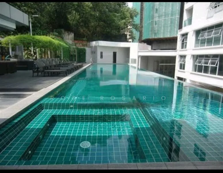 Exterior type: swimming pool deck; features: infinity pool, lap pool, pool deck with loungers, tiled pool surface in turquoise, surrounded by greenery, modern architecture, glass windows in background, concrete pathway; style: modern.