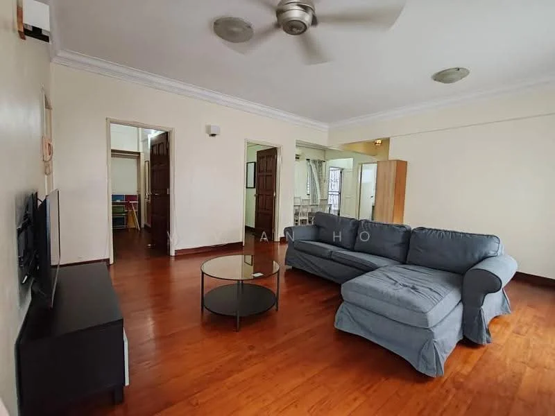 Living features: wooden flooring, light grey fabric sectional sofa, round glass coffee table, wall-mounted TV, ceiling fan with light, crown moulding, neutral painted walls, doorway leading to other rooms; style: contemporary.