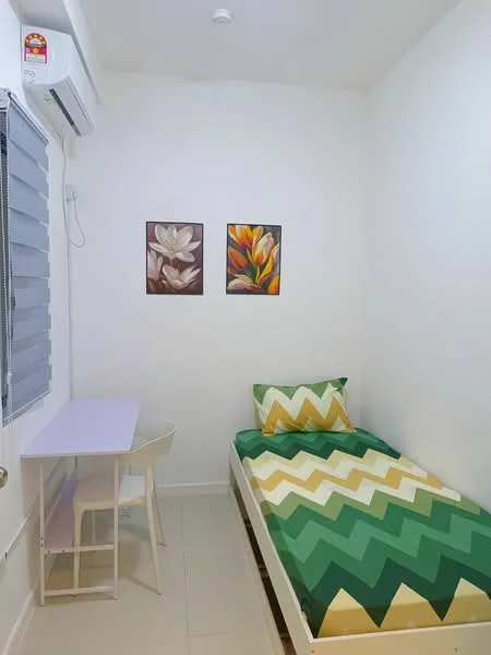 Bedroom features: single bed with green and yellow chevron bedding, white walls, tile flooring, air conditioning unit on wall, desk with purple surface, white chair, two framed floral artworks on wall, window with grey blinds; style: modern.