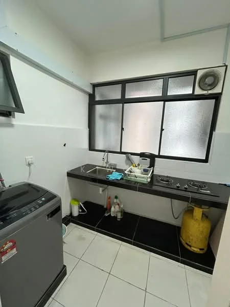 Kitchen features: single-bowl stainless-steel sink, chrome pull-down faucet, black countertop, two-burner gas hob, built-in wall cabinet, white tiled walls, black and white tiled flooring, window with frosted glass, washing machine, yellow gas cylinder, cleaning supplies, kitchen utensils; style: modern.