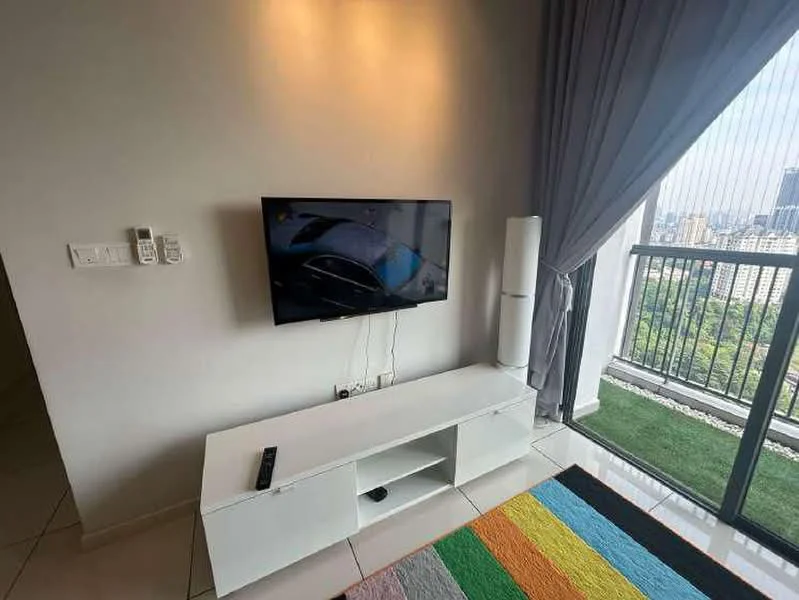 Living features: white TV console, wall-mounted TV, colorful area rug, floor-to-ceiling windows, curtains, greenery view, air conditioning unit, remote control; style: modern; view: garden.