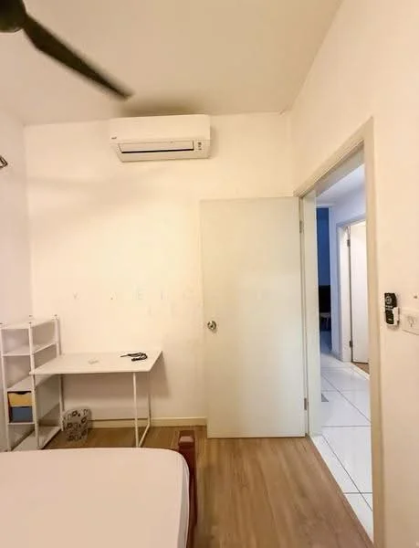 Room features: white painted walls, wooden flooring, 1 wall-mounted split AC, ceiling fan, door leading to another room, desk with chair, shelf unit, light switch, door frame.