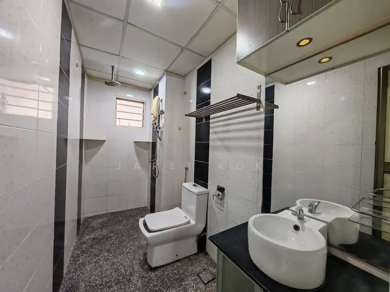 Bathroom features: white ceramic toilet, single-sink vanity with round basin, black countertop, mirror above sink, shower area with glass partition, tile cladding on walls, grey granite flooring, recessed ceiling lights, towel rack, window for natural light; style: modern.