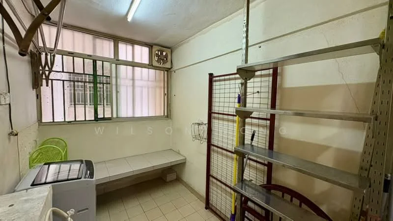 Laundry features: white tiled flooring, cream painted walls, metal shelving unit, washing machine, built-in bench, window with metal bars, green plastic chair, light fixture on ceiling.