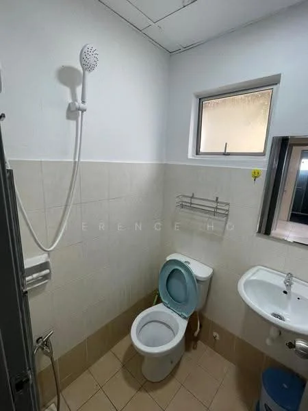 Bathroom features: white painted walls, cream tiled flooring, shower head with adjustable height, toilet, single-sink vanity, mirror above sink, wall-mounted towel rack, window for natural light.