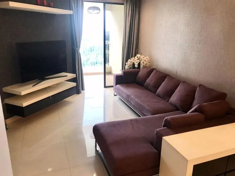 Living features: L-shape sectional sofa in burgundy, white coffee table, wall-mounted TV, TV console with storage, floor-to-ceiling windows, sliding glass door, curtains, decorative flowers in vase, glossy tile flooring, accent wall with textured finish; style: modern; view: garden.