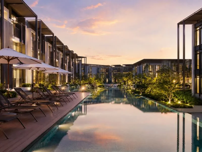 Exterior type: low-rise apartment block; features: infinity pool, pool deck with loungers, landscaped garden, mature trees, modern architecture, glass facade, outdoor umbrellas, ambient lighting, wooden decking, surrounded by greenery; style: modern.
