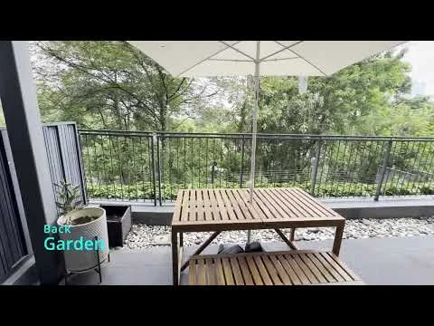 Room features: wooden outdoor dining table, white umbrella, railings, stone-paved flooring, garden view, potted plant; style: modern; view: garden.