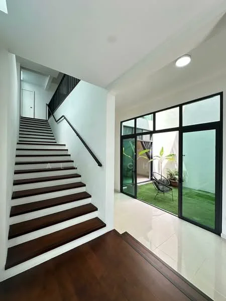 Hallway features: wooden staircase with handrail, white painted walls, recessed ceiling lights, glazed sliding doors, green grass flooring, indoor plants, black metal frame for doors, open layout; style: modern; view: garden.