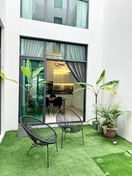 Room features: green artificial grass flooring, two black wicker chairs, large glass sliding door, curtains, indoor plants, potted fern, two banana plants, modern design; style: modern.