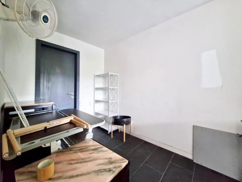 Room features: white painted walls, dark door, black tile flooring, ceiling fan, metal shelving unit, ironing board, small round table, unknown wall feature.