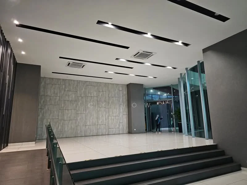 Room features: white tiled flooring, grey accent wall, textured wall paneling, recessed LED downlights, 2 wall-mounted split AC units, glass entrance doors, staircase with black steps, open layout, high ceiling, modern design; style: modern.