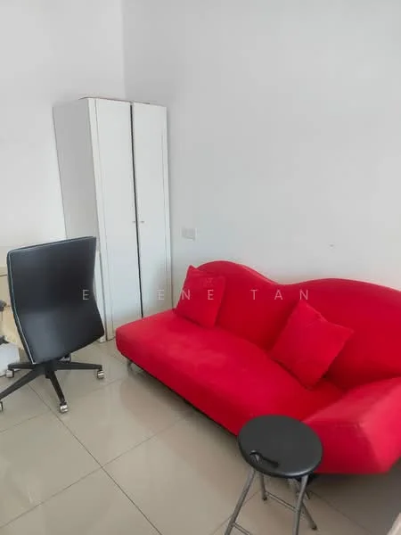 Room features: red fabric sofa with two cushions, black office chair on wheels, white wardrobe with sliding doors, small round black side table, glossy tile flooring in light color, plain white walls, natural light from window, minimalist decor; style: modern.
