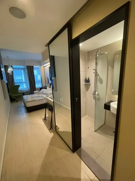 Room features: wooden flooring, glass partition, shower area with glass enclosure, wall-mounted showerhead, sink with wall-mounted faucet, mirror above sink, light fixture, curtains, bed with bedding, green accent chair, floor-to-ceiling windows, wall-mounted TV, dressing table, decorative wall art; style: modern; view: city.