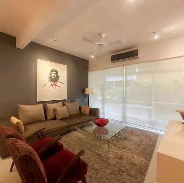 Living features: 3-seater fabric sofa in grey, 2 armchairs in dark wood, glass coffee table, area rug with neutral color, wall-mounted air conditioning unit, ceiling fan, large sliding glass door, sheer curtains, accent wall in dark grey, framed artwork, decorative bowl on coffee table; style: modern; view: garden.