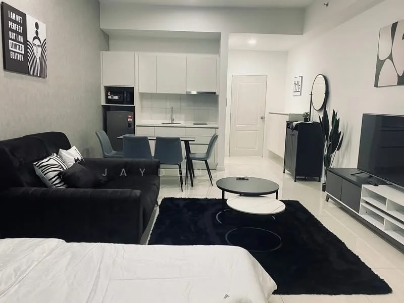 Living features: black fabric sofa, white bedding on sofa, black coffee table, area rug in black, wall-mounted TV unit, freestanding TV cabinet, decorative mirror, framed artwork on wall, potted plant, white walls, recessed lighting, dining table with four chairs, kitchenette with cabinets, stainless-steel fridge; style: modern.