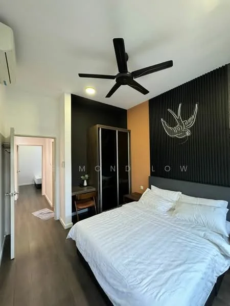 Bedroom features: queen-size bed with white bedding, black ceiling fan with light, wooden flooring, accent wall with black paneling, orange painted wall, built-in wardrobe with mirrored doors, study desk, wall-mounted artwork, air conditioning unit; style: modern. Room features: doorway leading to another room, light-colored walls, carpeted flooring.