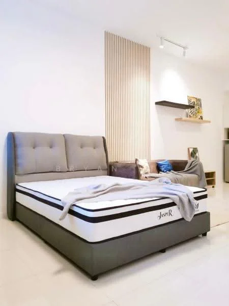 Bedroom features: king-size bed with upholstered headboard, grey bed frame, white bedding, decorative throw blanket, light-colored walls, tile flooring, wooden accent wall, shelf with decorative items, sofa in corner, recessed lighting; style: modern.
