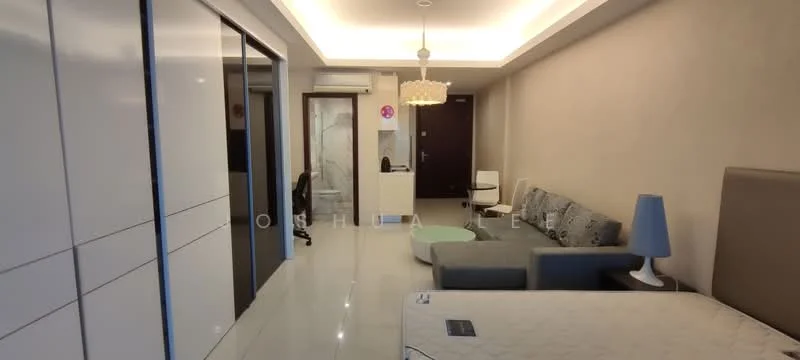 Living features: grey fabric sofa, round green coffee table, white floor tiles, recessed ceiling lights, chandelier, wall-mounted TV, built-in wardrobe with sliding doors, light grey accent wall, air conditioning unit, study desk with chair, queen-size bed with upholstered headboard, decorative lamp; style: modern. Room features: glass door leading to bathroom, white painted walls.