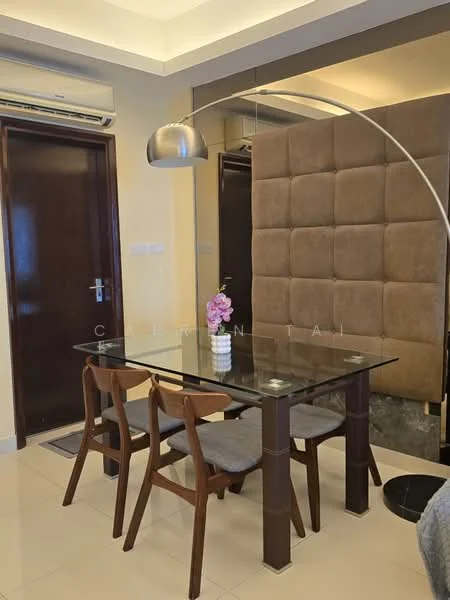 Dining features: glass dining table, 4 wooden dining chairs, pendant lamp, cream painted walls, tile flooring, wall paneling with brown upholstery, air conditioning unit, decorative flower vase; style: modern.