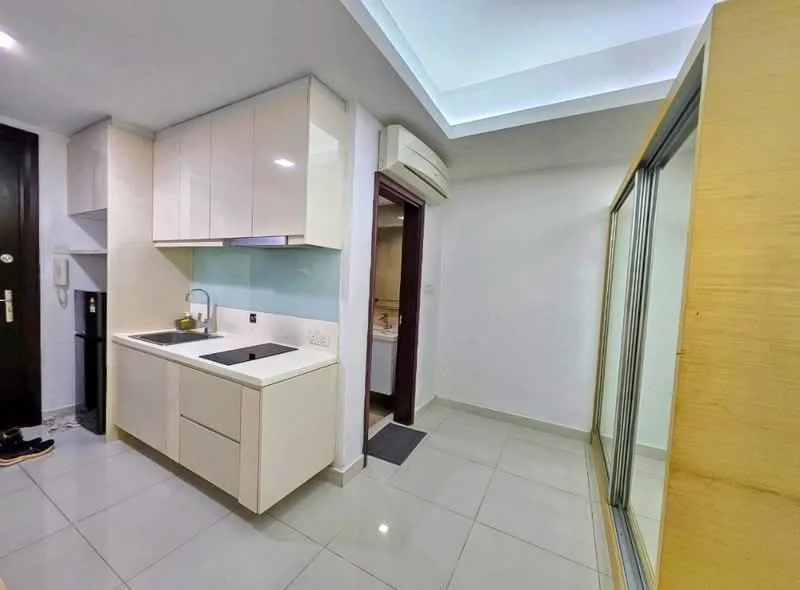 Kitchen features: white high-gloss cabinetry, single-bowl stainless-steel sink, chrome pull-down faucet, white quartz countertop, built-in refrigerator, ceramic tile flooring, recessed downlights, wall-mounted split AC; style: modern. Room features: grey wall, sliding glass door, tile flooring, doorway leading to bathroom.