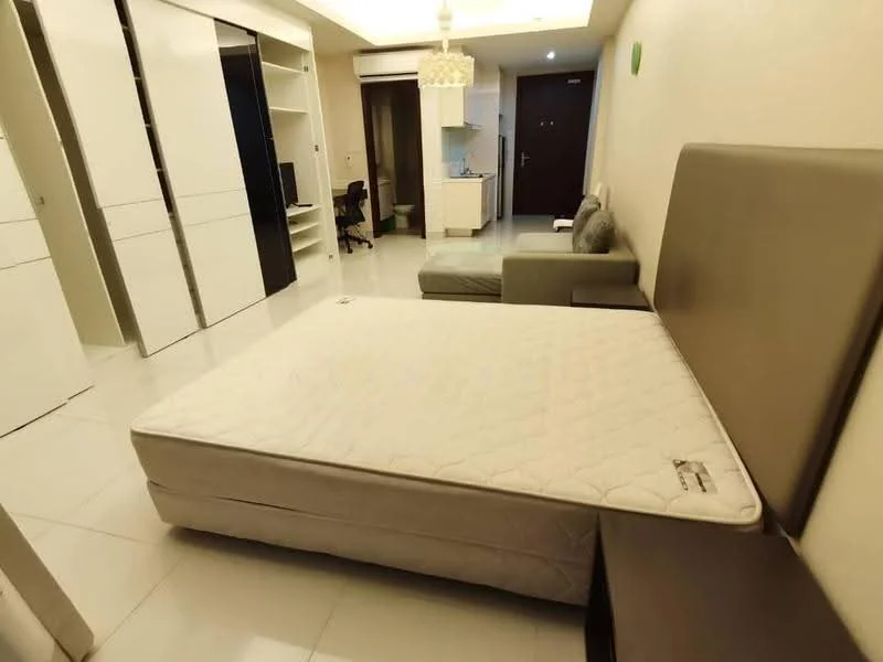 Bedroom features: queen-size bed, upholstered headboard, white bedding, nightstand, built-in wardrobe with sliding doors, light-colored walls, tile flooring, ceiling light fixture, sofa, desk chair, small desk, wall-mounted TV; style: modern.