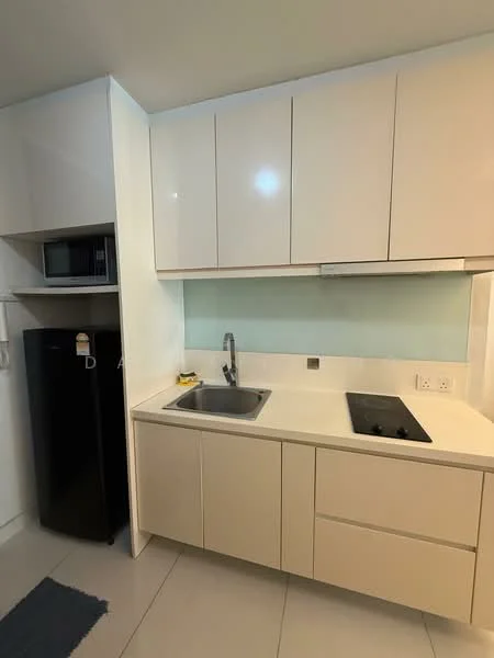 Kitchen features: white high-gloss cabinetry, stainless-steel sink, chrome pull-down faucet, black glass cooktop, built-in microwave, black refrigerator, white countertop, glass backsplash, grey floor tiles, under-cabinet lighting; style: modern.