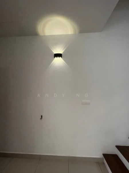 Room features: white painted walls, wall-mounted light fixture, tile flooring, staircase with wooden steps.