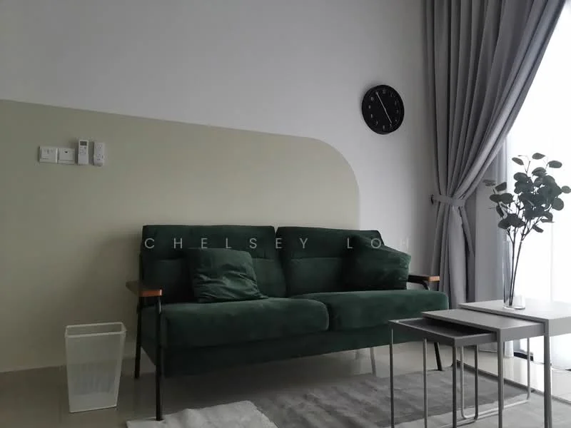 Living features: green fabric sofa, throw pillows, light grey area rug, white coffee table, small side table, floor-to-ceiling window, sheer curtains, wall clock, wall-mounted light switch, potted plant, painted accent wall in light beige, neutral wall color, modern decor; style: modern.