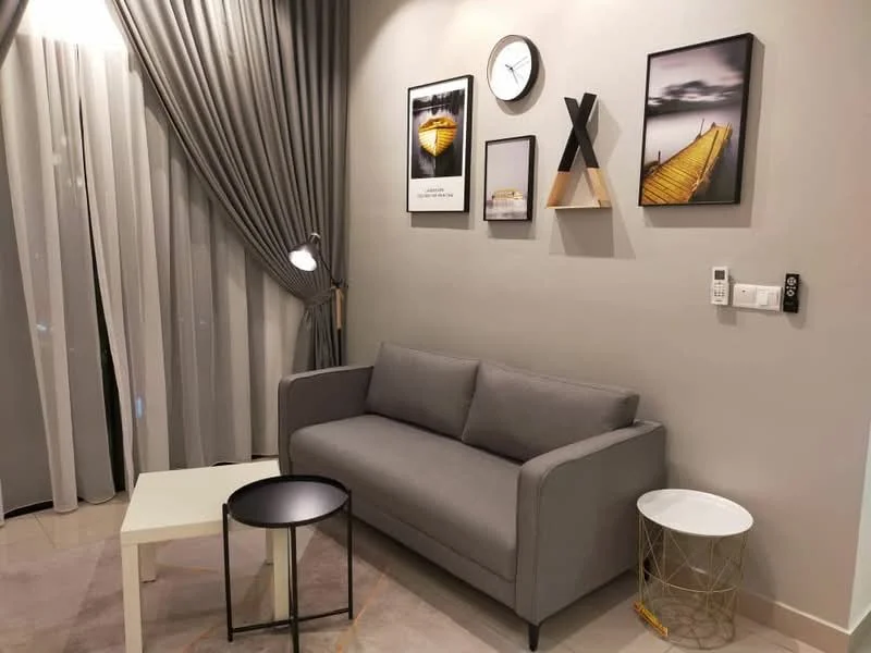 Living features: grey fabric 3-seater sofa, white coffee table, black side table, decorative wall art, wall clock, curtains in grey, floor lamp, light-colored tiled flooring, neutral painted walls, decorative shelf; style: modern.