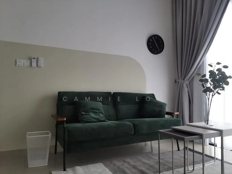 Living features: green fabric 3-seater sofa, two green throw pillows, white side table, small white wastebasket, light grey area rug, wall clock, floor-to-ceiling curtains, light grey wall with curved accent, neutral tile flooring; style: modern.