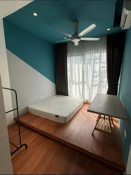 Bedroom features: blue accent wall, white painted walls, wooden flooring, 5-blade ceiling fan with light, floor-to-ceiling windows, sheer curtains, dark curtains, wooden desk, mattress on bed frame, step-up platform; style: modern.