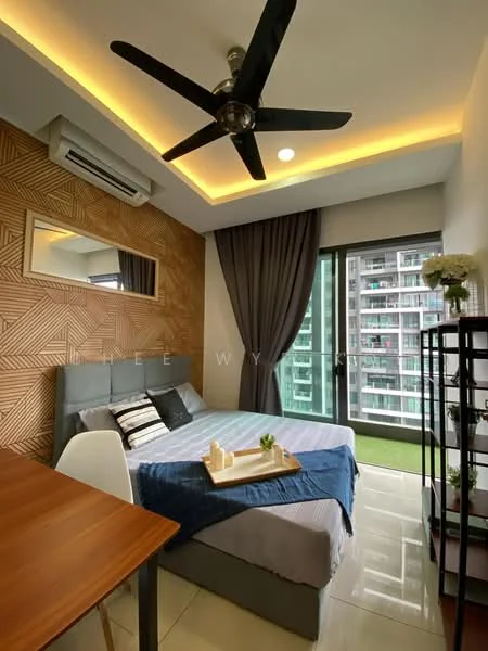 Bedroom features: king-size bed with grey upholstered headboard, white bedding with blue and grey striped pattern, 2 bedside pillows, 5-blade ceiling fan with light, wall-mounted air conditioning unit, wood accent wall with geometric pattern, floor-to-ceiling windows, sliding glass door leading to balcony, curtains in dark grey, decorative mirror, small side table with decorative items, open shelving unit, tile flooring; style: modern; view: garden.