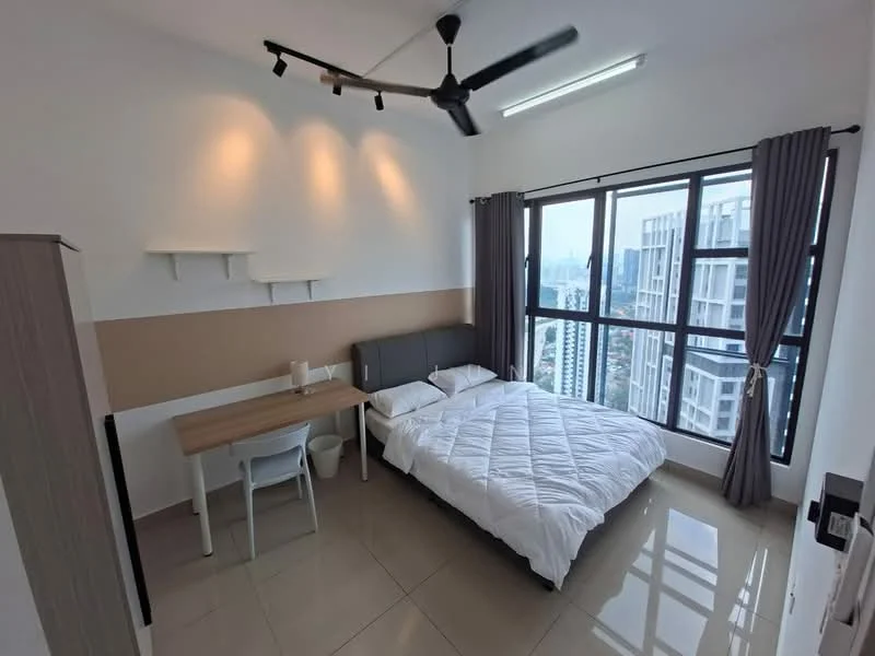 Bedroom features: queen-size bed with white bedding, grey upholstered headboard, study desk with white chair, floor-to-ceiling windows, city view, light grey walls, cream accent wall, ceiling fan with light, tile flooring, shelves above the bed, curtains on windows, built-in wardrobe; style: modern; view: city.