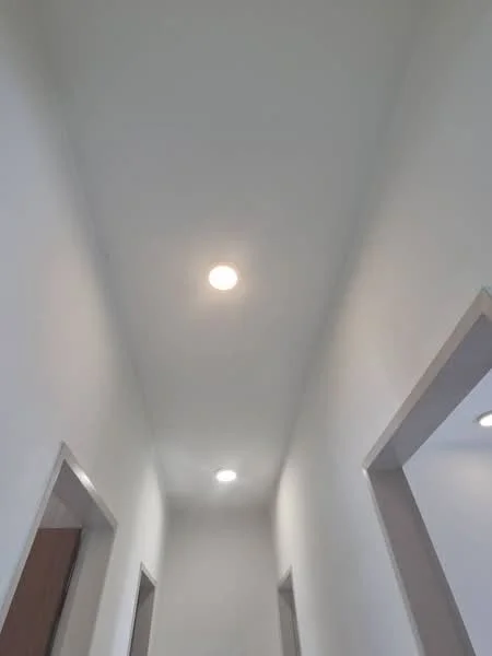 Hallway features: white painted walls, dropped ceiling, recessed LED downlights, doorway openings.