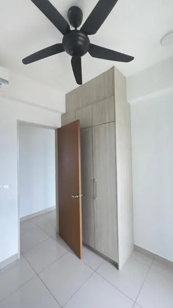 Room features: light-colored walls, grey tiled flooring, ceiling fan, wooden door, built-in wardrobe with sliding doors, neutral color cabinetry, door frame, corner wall; style: modern.