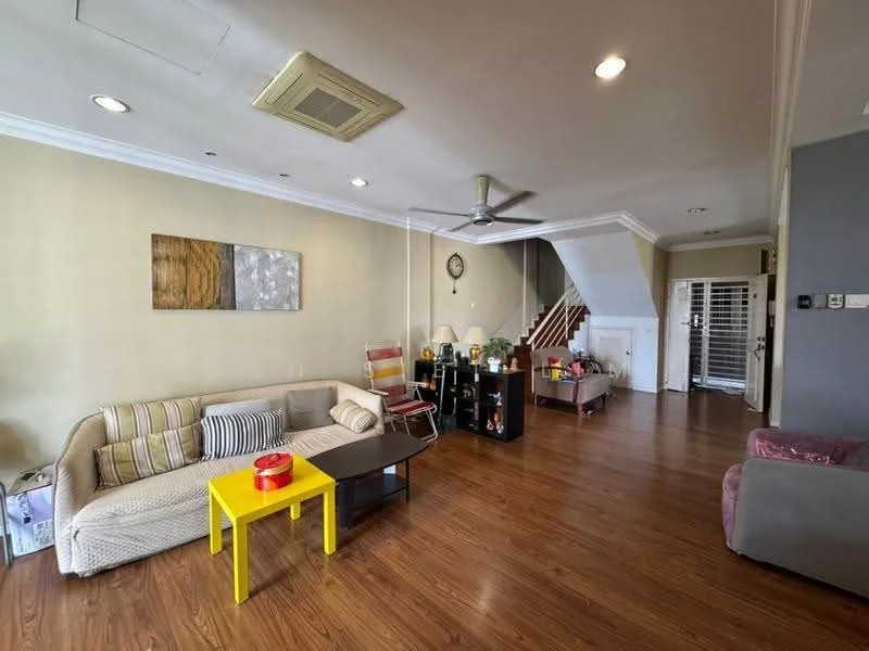Living features: laminate wood flooring, cream painted walls, tray ceiling with recessed lighting, 5-blade ceiling fan, sofa with beige upholstery, striped throw pillows, yellow coffee table, black side table, decorative artwork on wall, open staircase, bookshelf, armchair in purple upholstery; style: modern.