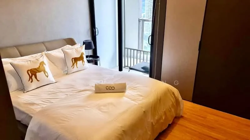 Bedroom features: king-size bed with upholstered headboard, white bedding, decorative pillows with horse design, wooden flooring, floor-to-ceiling windows, black bedside lamp, sliding glass door leading to balcony, built-in wardrobe with sliding doors, neutral wall color, curtains, area rug; style: modern; view: city.