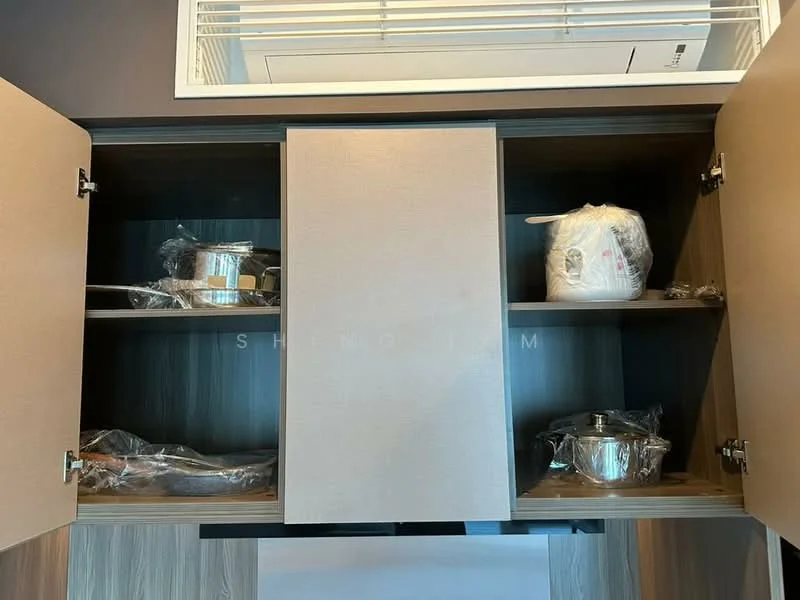 Kitchen features: upper cabinetry with two doors, wooden cabinet finish, stainless-steel pots, plastic wrap on pots, air conditioning unit visible, open shelving, neutral color scheme; style: modern.